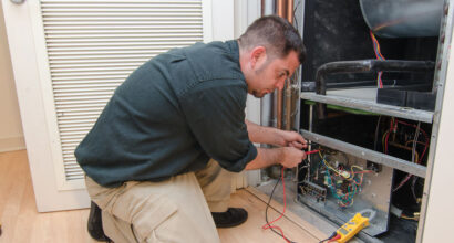 HVAC technician working on a residential heat pump